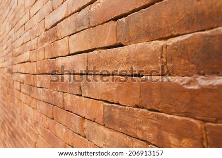 Old brick wall with diminishing perspective.