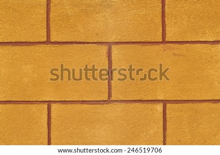 It is Orange cement block wall for pattern.