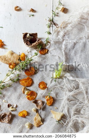 still life composition with vegetables and walnuts on jute napkin