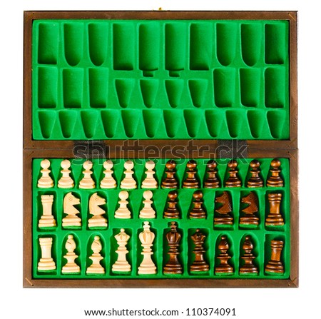 set of wooden chess pieces in green box