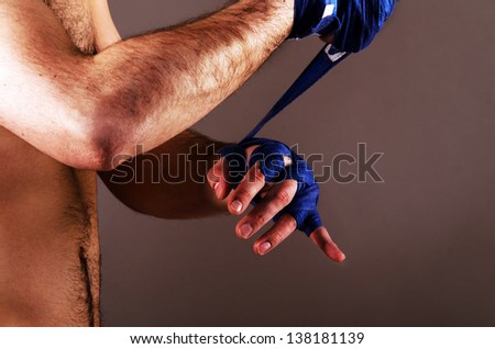 mma fighter is getting ready on gray background