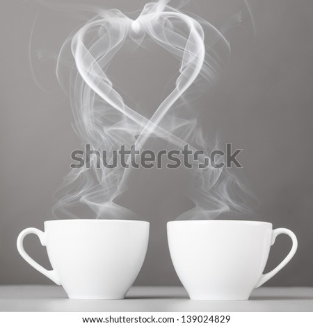 Love And Coffee. Heart Silhouette From Steaming Hot Coffee Cups