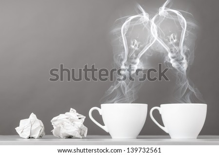 creating idea. bulbs silhouette from steaming hot coffee cup