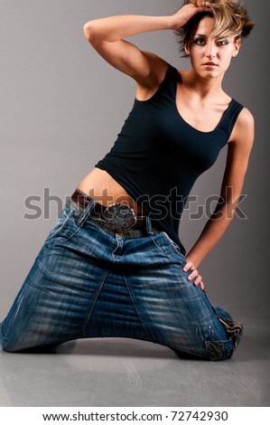 woman wearing black tank top and jeans