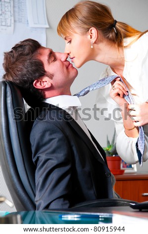 stock photo businesswoman is seducing her boss at office