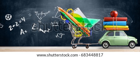 Back to school sale background. Car delivering shopping cart full of accessories, books and apple against blackboard with education symbols.
