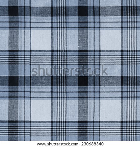 Tartan plaid blue natural cotton fabric. Seamless tiles texture for the background