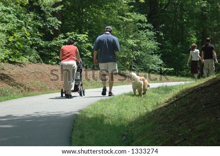 Family On A Walk With Their Dog