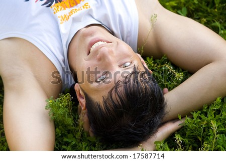 man lie on grass in the park