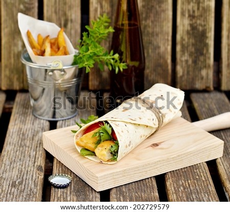 Chicken kebab in pita bread with vegetables. Selective focus