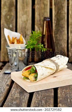 Chicken kebab in pita bread with vegetables. Selective focus