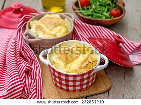 French traditional potato, ham and cheese meal Tartiflette. Selective focus