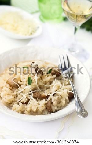 Risotto with mushrooms ceps boletus served with cheese. Selective focus