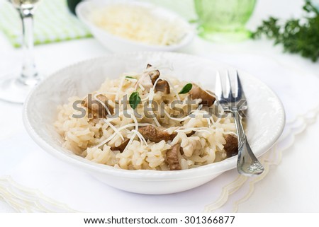 Risotto with mushrooms ceps boletus served with cheese. Selective focus