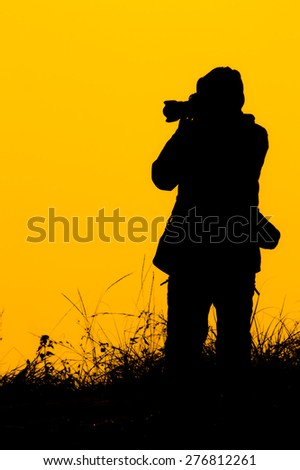The silhouette of the traveler take a picture