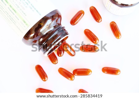 gel vitamin supplements on white, group of gel capsules