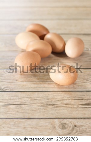 Organic Eggs from farm on wood background.