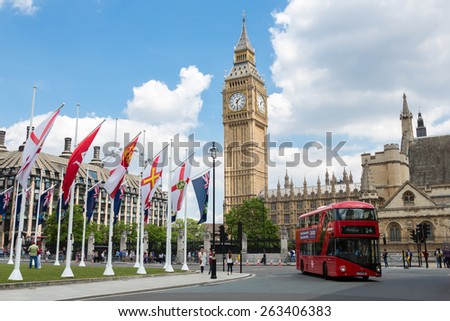 LONDON, ENGLAND - JUNE 1, 2014 - Big Ben Clock Tower and Westminster abbey with red double-decker bus