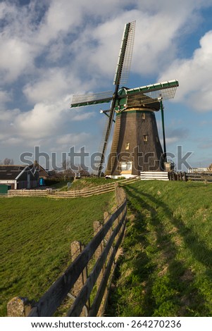Traditional Dutch landscape with  windmill at the Rooversbroekdijk, Lisse, Holland.