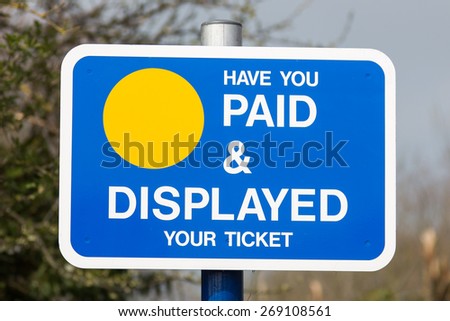 Sign for visitors at a car park. Have you paid & displayed your ticket sign. \
Photo taken on April 07, 2015