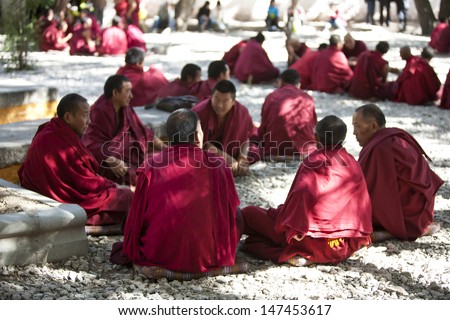 LHASA, TIBET- OCT 07: Tibetan monks are debating over Buddhist Scriptures at the Sera Monastery on October 07, 2011 in Lhasa, Tibet.