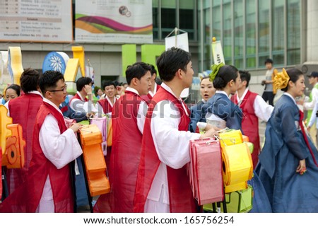 SEOUL, SOUTH KOREA-MAY 12: People wearing traditional clothes participate Culture Performances for celebration of Lotus Lantern Festival at Jogyesa Temple on May 12, 2013 in Seoul, South Korea.