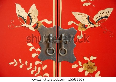 Beautiful decor lock on the door of old Chinese furniture.