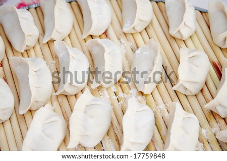 Chinese dumpling is one of the most important foods in Chinese New Year. Since the shape of Chinese dumplings is similar to ancient Chinese gold or silver ingots, they symbolize wealth.