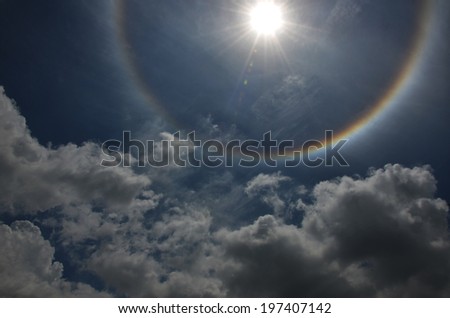 Beautiful sun halo with the blue sky and half spectrum