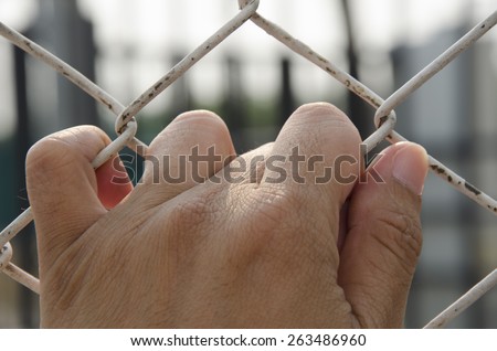 hand of the prisoner who need freedom