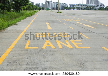 Bus lane sign painted on concrete road