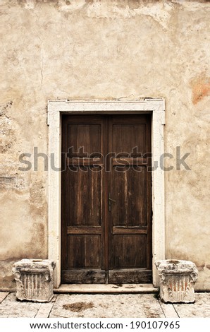 The door. Old wooden door of a Romanesque church of the eleventh century