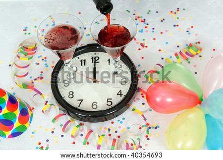 champagne in glasses standing on clock on table