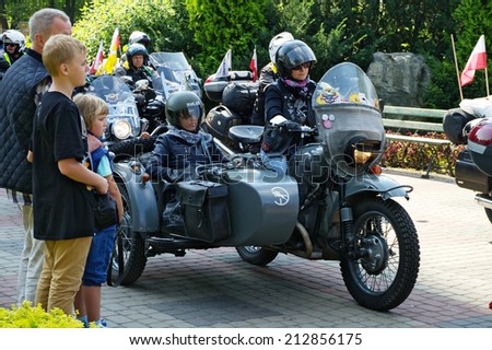 WARSAW, POLAND - AUGUST 23: Vintage motorcycle with a sidecar during start of the 14th Motorcycle Katyn Rally on August 23, 2014 in Warsaw, Poland.