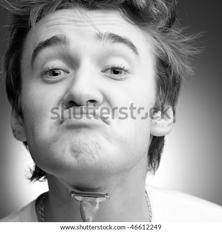A funny young man shaves oneself. Black and White