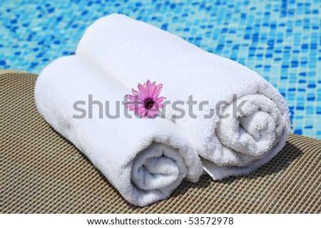 Close-up of towels at a luxury swimming pool