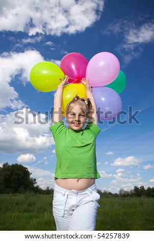 Girl Jump in the field under blue sky