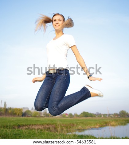 Woman jump in the Field