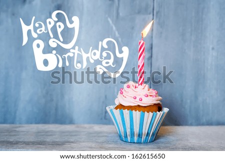 Birthday greeting card with cupcake and candle