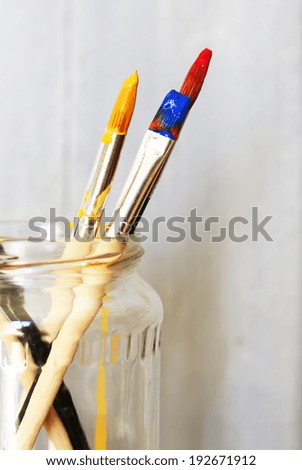 Photo of paint brushes in a jar