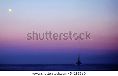 Photo of yacht on sunset, blue and pink sky, yellow moon