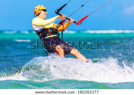 young smiing  kite surfer on tropical sea background Extreme Sport Kite surfing