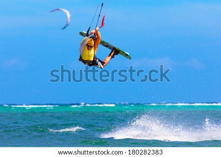 young kite surfer on tropical sea background Extreme Sport Kite surfing