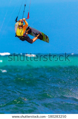 young  kite surfer on tropical sea background Extreme Sport Kite surfing