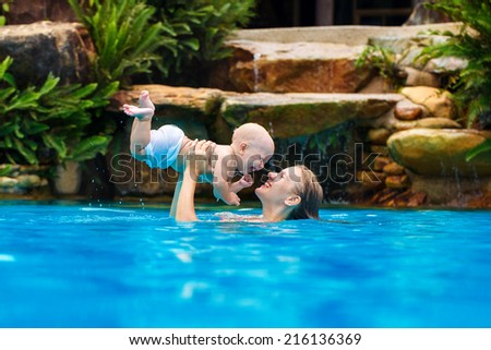 Beautiful mother and child in the open air. Nature. Outdoor portrait of a happy family. The joy. The baby and mother in the tropics.