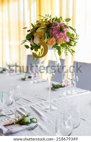 Floral arrangement for decoration wedding table for guests. Room table. Vintage