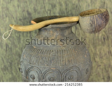 Antique pitcher and ancient kitchen utensils.