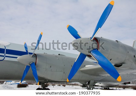 Angle view of plane with 2 engine and screws. Photo taken in winter on blue sky background.  This plan was used in 18 different countries. The plan contains 120 passengers.