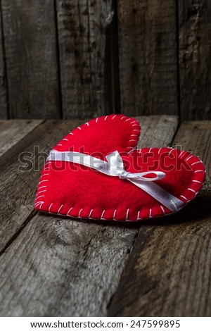 Vintage wooden background with hand made heart. Special love card for Valentine\'s Day