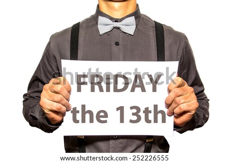 Young man in shirt and bowtie with board and message on it Friday the 13th